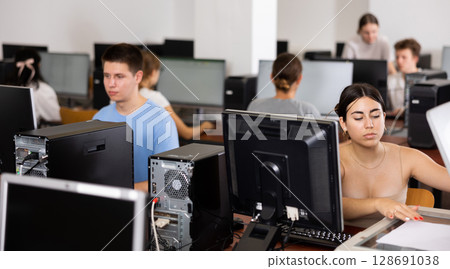 Young woman using scanner in computer class Young woman using scanner in computer class 128691038