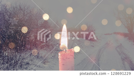 Image of candles over winter road landscape 128691229