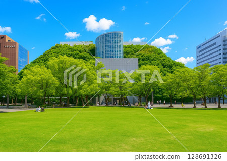 Acros Fukuoka and Tenjin Central Park with young leaves and fresh greenery Acros Fukuoka and Tenjin Central Park with young leaves and fresh greenery 128691326