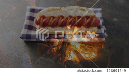 Image of flame over hot dog and cloth 128691349