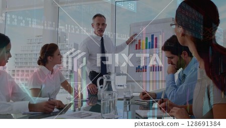 Image of graphs over diverse businesspeople working Image of graphs over diverse businesspeople working 128691384