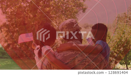 Image of hearts over back of african american soldier father holding kids with usa flags 128691404