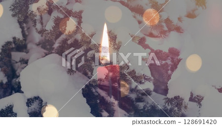 Image of candles over winter coniferous trees with snow Image of candles over winter coniferous trees with snow 128691420