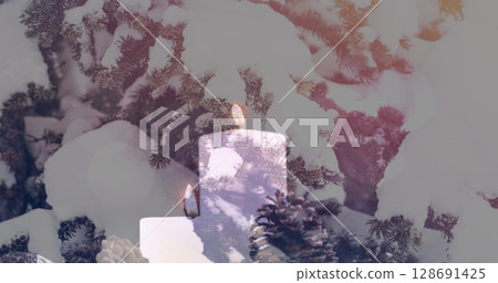 Image of candles over winter coniferous trees with snow 128691425