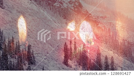 Image of candles over winter mountain landscape 128691427