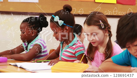Image of math formulas over class of diverse children learning at school 128691437