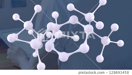 Image of molecules over caucasian man using tablet Image of molecules over caucasian man using tablet 128691458