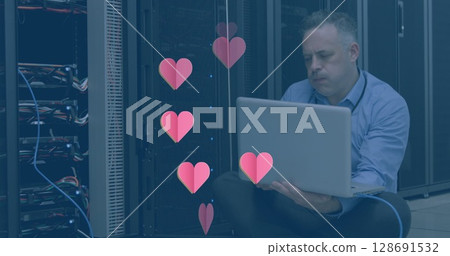 Image of hearts over caucasian businessman in server room Image of hearts over caucasian businessman in server room 128691532