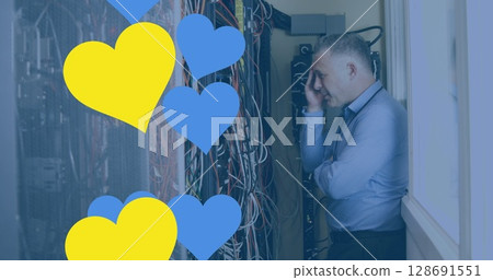 Image of hearts over caucasian businessman in server room 128691551