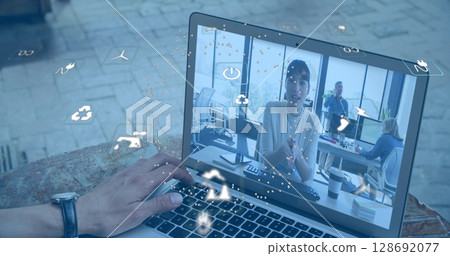 Image of ecology icons over biracial businesswoman having image call Image of ecology icons over biracial businesswoman having image call 128692077