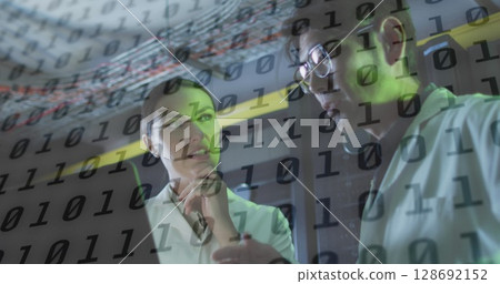 Image of data processing over diverse workers in server room Image of data processing over diverse workers in server room 128692152