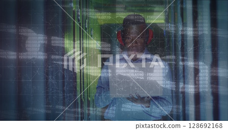 Image of data processing over african american male worker in server room 128692168