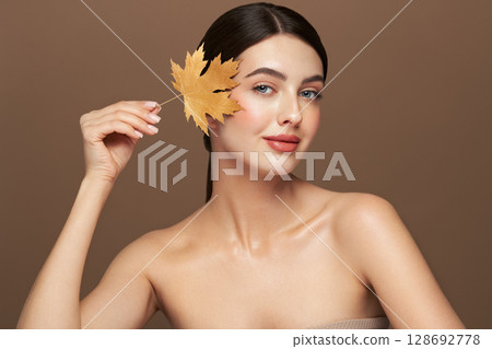 Autumn portrait of beautiful woman with clean fresh skin 128692778