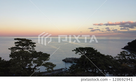 Sunset over the sea 128692941