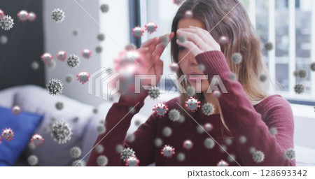 Image of virus cells over caucasian woman sneezing 128693342