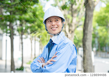 Middle-aged man in work clothes Middle-aged man in work clothes 128694486
