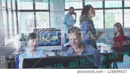 Image of financial data over diverse businesspeople working on computer in office Image of financial data over diverse businesspeople working on computer in office 128694637
