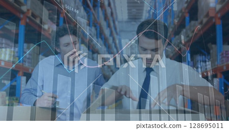 Image of financial graphs over caucasian male warehouse workers 128695011