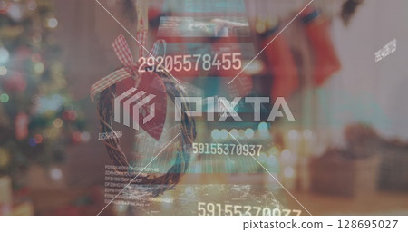 Image of data processing on screens over christmas decoration Image of data processing on screens over christmas decoration 128695027
