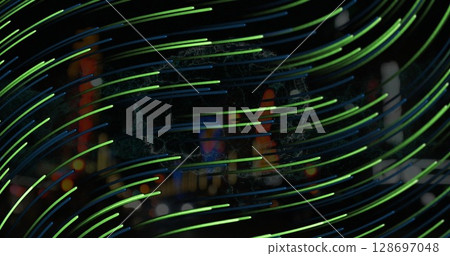 Image of green lines moving over night blurred cityscape Image of green lines moving over night blurred cityscape 128697048