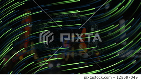 Image of green lines moving over night blurred cityscape Image of green lines moving over night blurred cityscape 128697049