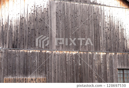 Wooden building walls made with burnt cedar boards Wooden building walls made with burnt cedar boards 128697530