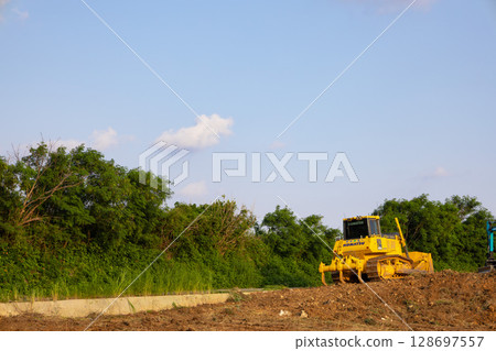 Development of a tropical resort vacation, construction site under blue skies, heavy machinery and excavators on the ground at a construction site (Miyakojima City, Okinawa Prefecture) Development of a tropical resort vacation, construction site under blue skies, heavy machinery and excavators on the ground at a construction site (Miyakojima City, Okinawa Prefecture) 128697557
