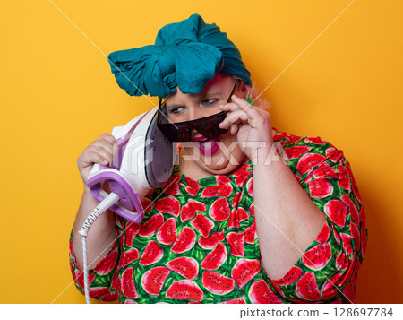 Colorful Woman Holding Iron and Shouting with Funny Expression Colorful Woman Holding Iron and Shouting with Funny Expression 128697784