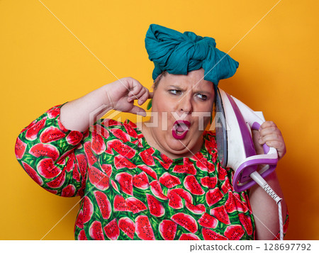 Colorful Woman Holding Iron and Shouting with Funny Expression Colorful Woman Holding Iron and Shouting with Funny Expression 128697792
