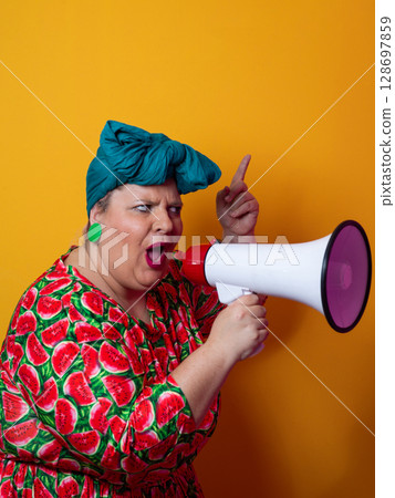 Colorful Retro Woman Shouting Through a Megaphone Colorful Retro Woman Shouting Through a Megaphone 128697859