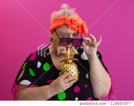 Stylish Woman with Pineapple Drink Against Pink Background 128697877