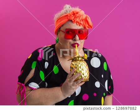 Stylish Woman with Pineapple Drink Against Pink Background Stylish Woman with Pineapple Drink Against Pink Background 128697882