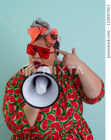 Colorful Retro Woman Shouting Through a Megaphone Colorful Retro Woman Shouting Through a Megaphone 128697921