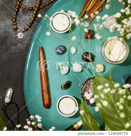 Self-care, healing composition with rosary beads, aroma sticks, chakra stones, sandalwood sticks and candle on a green marble podium. Concept of relax, energy healing, meditation and me time. Flat lay Self-care, healing composition with rosary beads, aroma sticks, chakra stones, sandalwood sticks and candle on a green marble podium. Concept of relax, energy healing, meditation and me time. Flat lay 128698770