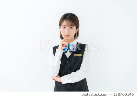 Young woman in uniform, business, worries Young woman in uniform, business, worries 128700149