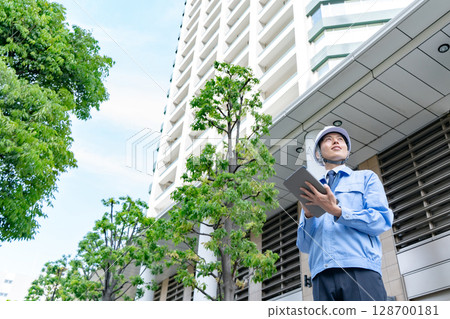 Middle-aged man in work clothes Middle-aged man in work clothes 128700181