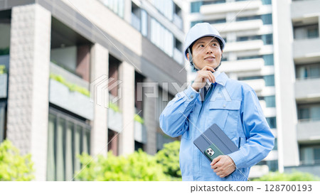 Middle-aged man in work clothes Middle-aged man in work clothes 128700193