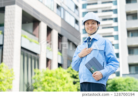 Middle-aged man in work clothes Middle-aged man in work clothes 128700194