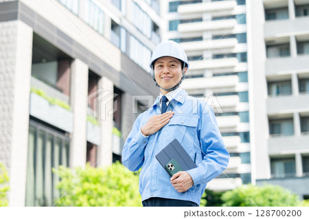 Middle-aged man in work clothes Middle-aged man in work clothes 128700200