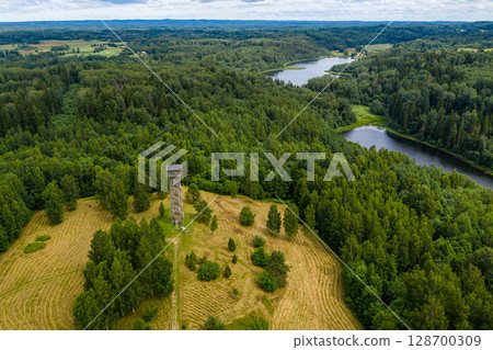 Wooden observation tower in Paganamaa, Rouge Parish, Estonia, aerial view Wooden observation tower in Paganamaa, Rouge Parish, Estonia, aerial view 128700309
