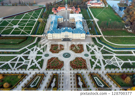 Aerial view on baroque garden of Rundale palace in autumn time. Symmetrical park in vibrant colors Aerial view on baroque garden of Rundale palace in autumn time. Symmetrical park in vibrant colors 128700377