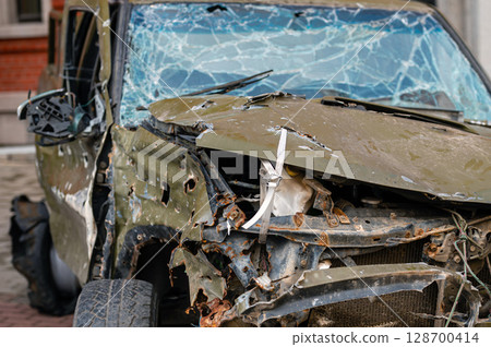 A car donated by Latvia that suffered in the Ukrainian war, close up of the details A car donated by Latvia that suffered in the Ukrainian war, close up of the details 128700414