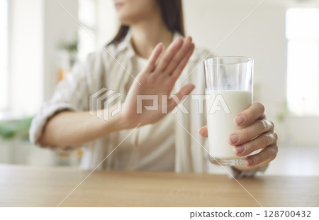 Woman Refusing Milk Glass Due To Lactose Intolerance 128700432