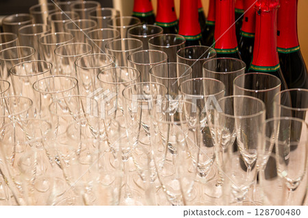 catering services. rows of shampagne glasses at restaurant party or celebration, closeup 128700480