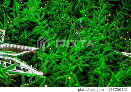 Christmas outdoor background with decorated fir tree branches and Lights blurred bokeh. Christmas outdoor background with decorated fir tree branches and Lights blurred bokeh. 128700501