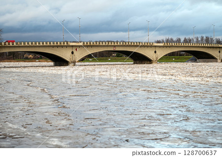 A huge load of ice in the Lielupe river near the road traffic bridge in Jelgava. A huge load of ice in the Lielupe river near the road traffic bridge in Jelgava. 128700637