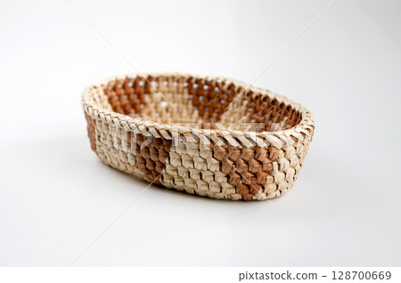 Wicker basket on a white background, isolate, close-up Wicker basket on a white background, isolate, close-up 128700669