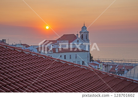Sunrise over Alfama and Saint Stephen Church Sunrise over Alfama and Saint Stephen Church 128701602