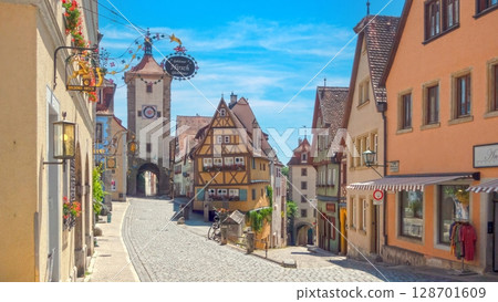 Medieval architecture and cobblestone street in Rothenburg Medieval architecture and cobblestone street in Rothenburg 128701609
