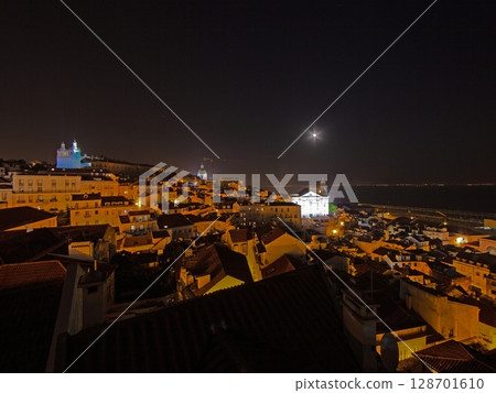 Lisbon by night with churches and rooftops Lisbon by night with churches and rooftops 128701610